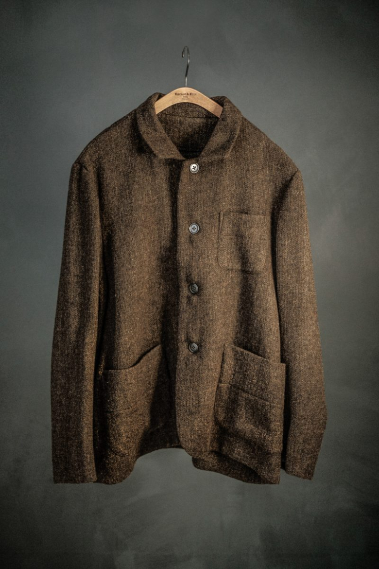 Garment in brown fabric on hanger