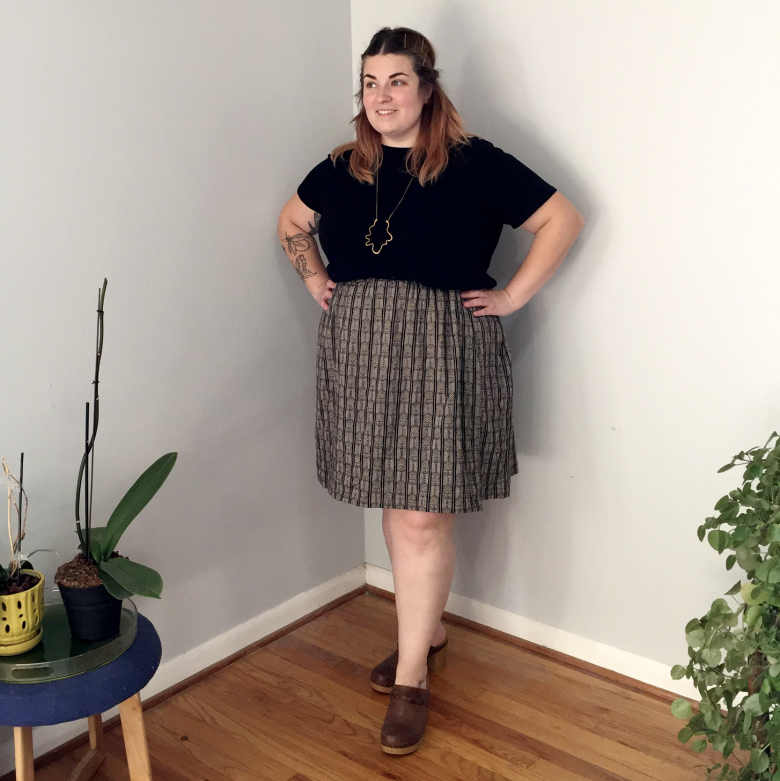 model wearing patterned short version of skirt