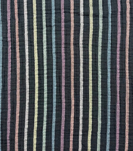 Photo of black fabric with muted rainbow stripes.
