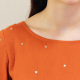 Close up view of blouse front neckline