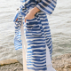 side view of person wearing garment with hands in pockets