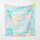 square cut of fabric with an abstract floral print, in shades of aqua, peach, neon coral, and offwhite