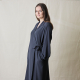 model shot of the coat made in blue fabric, side