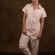model shot of the coverall made in a light pink fabric