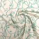 white fabric with faces outlined in light green