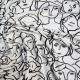 white fabric with faces outlined in black