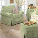 Living room chair, table, ottoman, and couch covered in green fabric
