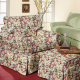 Living room chair and ottoman covered in floral fabric