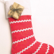 Red Christmas stocking with white stripes