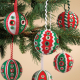 Various ornaments hanging on a Christmas tree