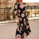 woman wearing dress (black with pink flowers) ankle length