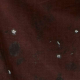 Close up of flat fabric, color is deep rusty red with flowers in darker shades as well as small white flowers