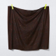 General view of fabric hung with 2 clothespins to show the drape, color is deep rusty red with flowers in darker shades as well as small white flowers