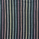 Photo of black fabric with muted rainbow stripes.