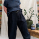 Woman modeling dark trousers
