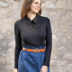 thin brunette woman wearing a black long sleeved collared shirt