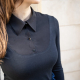 thin brunette woman wearing a black long sleeved collared shirt