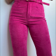a slim woman wears tight hot pink corduroy jeans and matching pink top