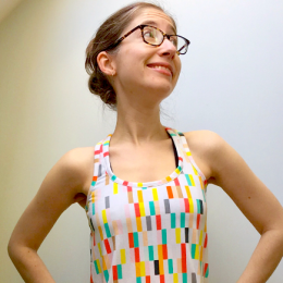 Photo of Ariane in a colourful tank top 