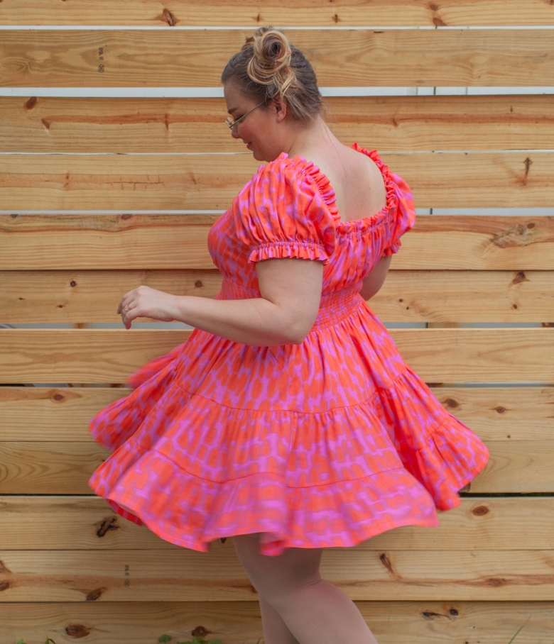 spinning back view of pink dress