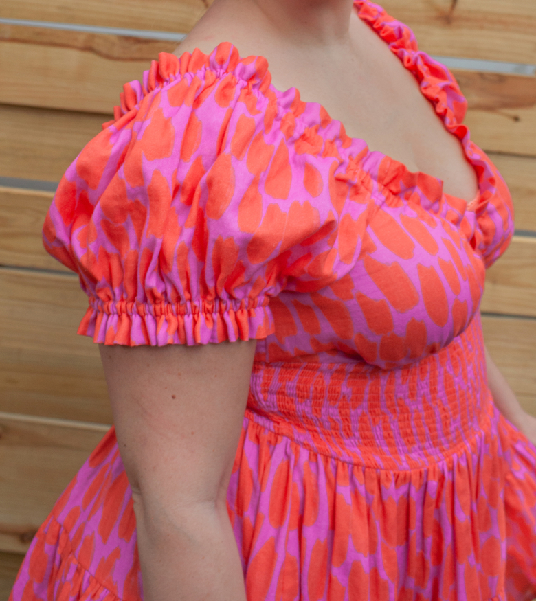 side closeup of shoulder and sleeve of pink dress