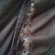 another close-up of where old butterfly chair cover fits over frame - frame is poking through, seams are ripped