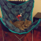 Gray cat half sleeping (very content) in a blue butterfly chair